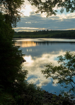 View of Fontburn Reservoir, Northumberland, England, UK, in evening light.