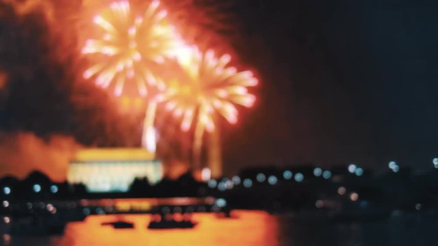 POV Closeup on the silhouette of a woman's hands taking photos of fireworks show with a mobile phone, shoot in 4K