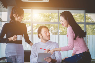 Smile couple of young people at a business meeting in meeting room. Business training concept,working together discussing.