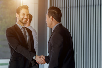Successful Business people hand shaking after great deal.