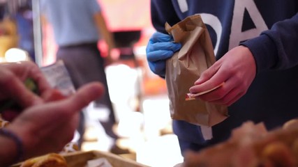 Food cash transaction at bakery goods stall