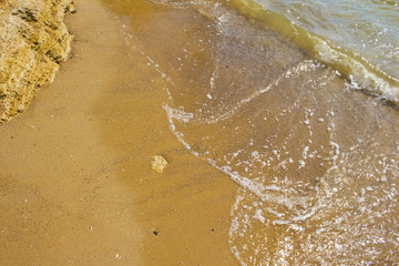 Soft wave of the sea on the sandy beach