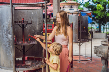 Incense sticks on joss stick pot are burning and smoke use for pay respect to the Buddha, Incense...