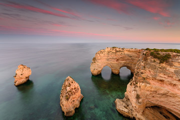 Amazing sunset at Marinha Beach in the Algarve, Portugal. Landscape with strong colors of one of the main holiday destinations in europe. Summer tourist attraction.