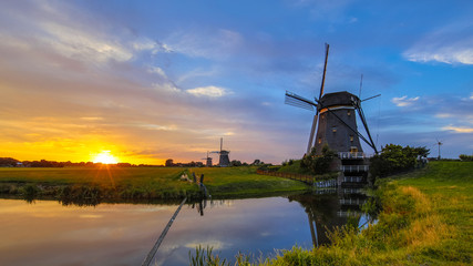 Three dutchwooden windmills