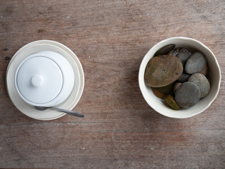 Stone and cup on the wooden table