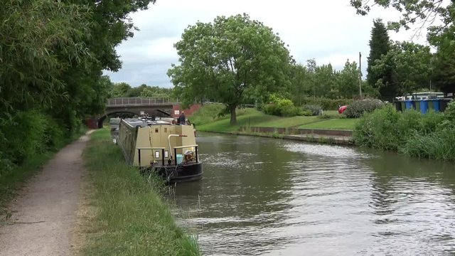 Beautiful landscape with coventry canal around Tamworth, UK with running boat.