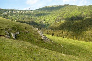 Fototapeta na wymiar View of Bucegi Mountains, Bucegi National Park, Romania, clear blue sky, few clouds, sunny summer day, perfect for hiking