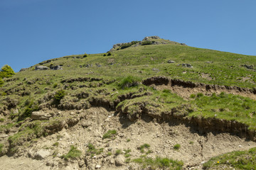 View of Bucegi Mountains, Bucegi National Park, Romania, clear blue sky, few clouds, sunny summer day, perfect for hiking