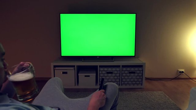 Unhappy and disappointed man watches football