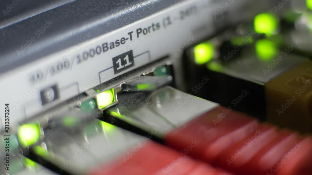 Poster macro shot of a server with flashing green lights for connection and lot of internet cables