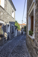 Perspective shot of old middle age design street with stone road at Lesvos, in Mytilene