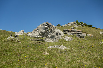 View of Bucegi Mountains, Bucegi National Park, Romania, clear blue sky, few clouds, sunny summer day, perfect for hiking