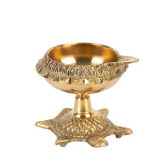 Brass indian lamp for Diwali on white backgound