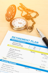 Retirement plan with pocket watch; document is mock-up