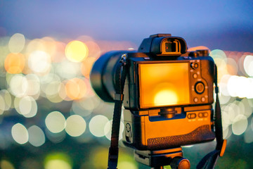 Mirrorless Camera and bettery grip with colorful bokeh
