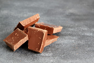 Black chocolate on dark background, close-up