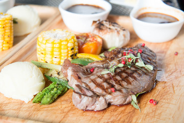 Spicy beef steak on wooden platter