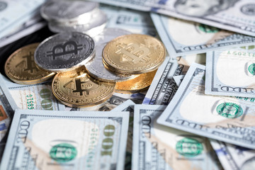golden bitcoin coin on us dollars close up. Electronic crypto currency