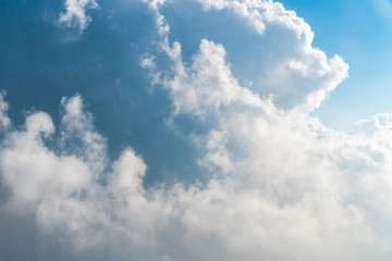Obraz premium Dramatic cloud blue sky in the airplane window.