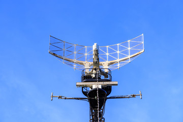 Warship radar antenna with blue sky