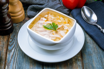 Chicken soup bouillon in a plate