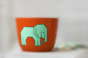 Orange plant pot with cute elephant sticker