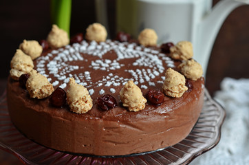 Cooked chocolate cheesecake on a glass plateau