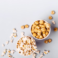 Sweet and salted popcorn on a blue background