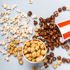 Assorted popcorn set in paper striped white red cup. Sweet and salty popcorn