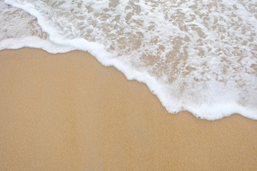 Fototapeta na wymiar sand beach and sea wave