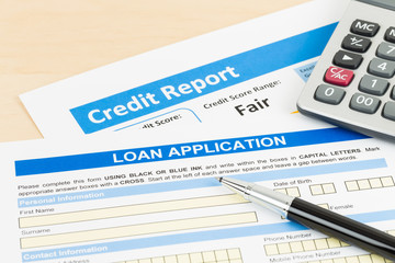 Loan application form fair credit score with calculator, and pen