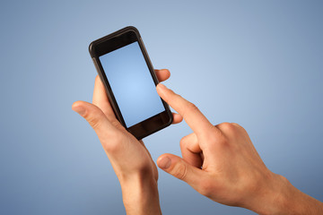 Female fingers touching blank smartphone