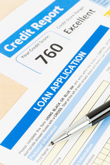 Loan application form excellent credit score with pen
