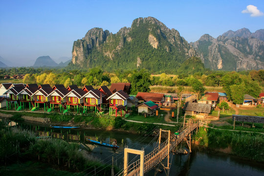 Row of tourist bungalows along Nam Song River in Vang Vieng, Vientiane Province, Laos