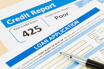 Loan application form poor credit score with pen