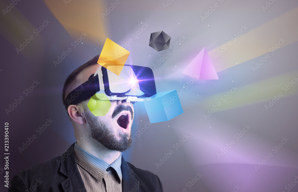 Poster amazed businessman with virtual reality colorful geometric shapes in front of him