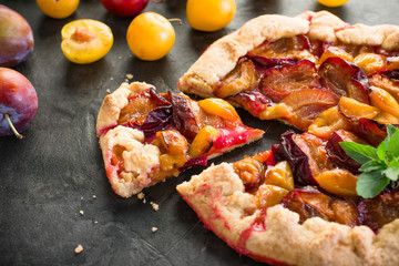 Galette Plum on the Black Background Summer Fruit Cake Fresh Baking Place Copying