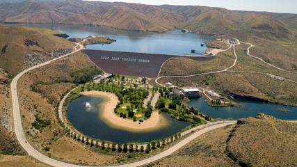 Reservoir behind Lucky Peak Dam on the Boise River with swimming park filled with trees