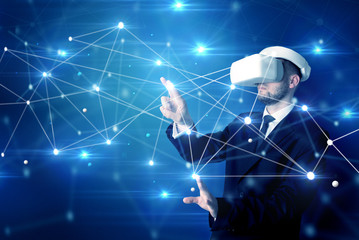 Businessman in virtual reality goggles investigate global network connectivity concept
