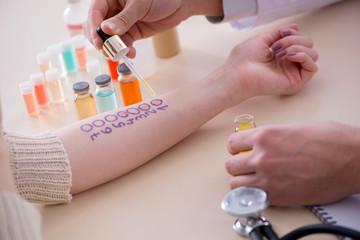 Doctor testing allergy reaction of patient in hospital