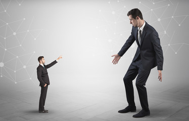 Small businessman aiming at a big businessman with connection and network concept
