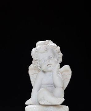 Figurine Of Baby Angel On Black Background 2