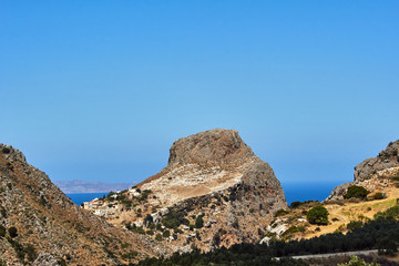 A village and rocky mountains on the island of Crete, Greece.