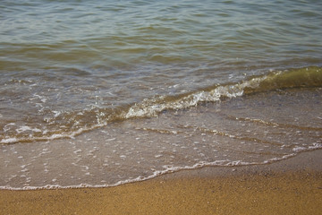 Soft wave of the sea on the sandy beach