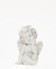Fototapeta na wymiar Figurine Of Baby Angel On White Background 1