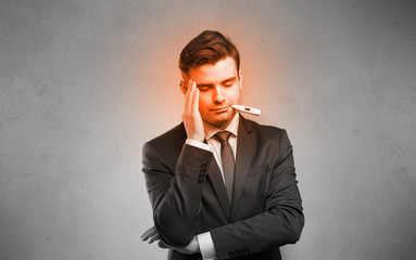 Fever businessman with burning red head concept
