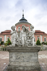 Fototapeta na wymiar Zolochiv, Ukraine - JUNE 02 2018: Photo of statue of three boys in the garden of the castle in Zolochiv, Ukraine