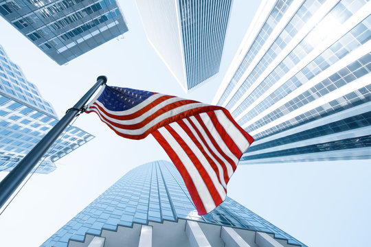 View of American flag on blue building background