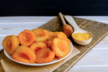 Fresh and fragrant slices of apricot on the table